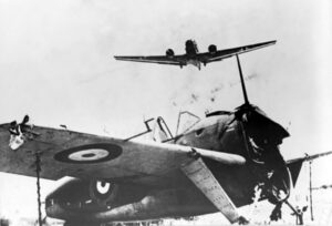 unservicable Brewster 339B Buffalo (foreground) & German Junker Ju 52/3m (landing), May 1941, Crete airfield (likely Maleme)